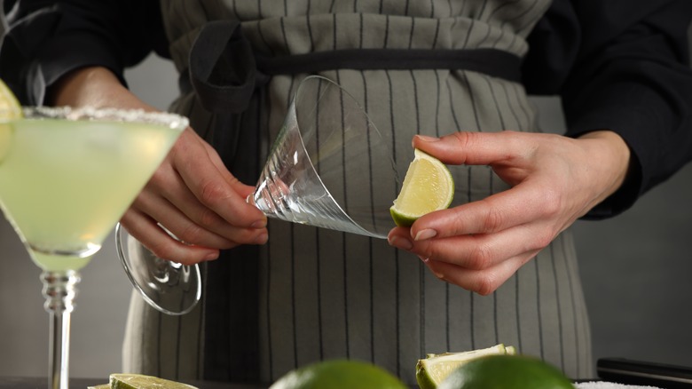 Person making margaritas