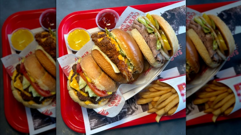 A tray filled with Roy Rogers sandwiches and fries