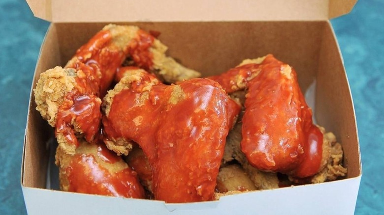 box of chicken wings with mambo sauce