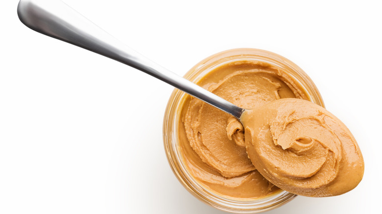 peanut butter in jar and spoon