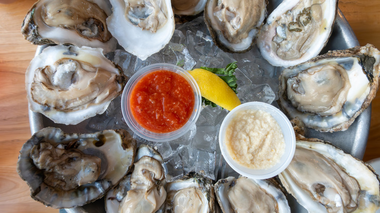 fresh oyster being shucked