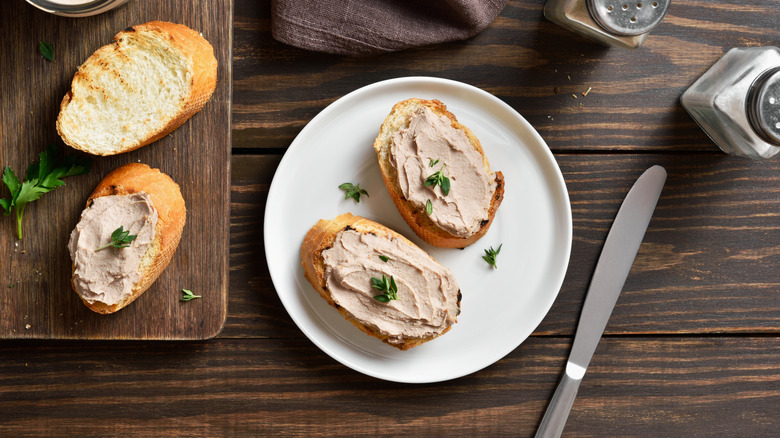 Chicken liver pate on spread on toast