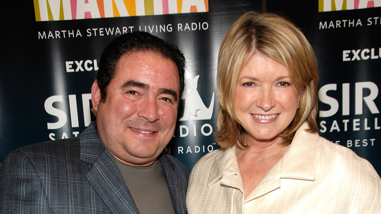 Martha Stewart and Emeril Lagasse standing together and smiling