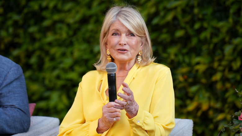 martha stewart speaks on stage at an event