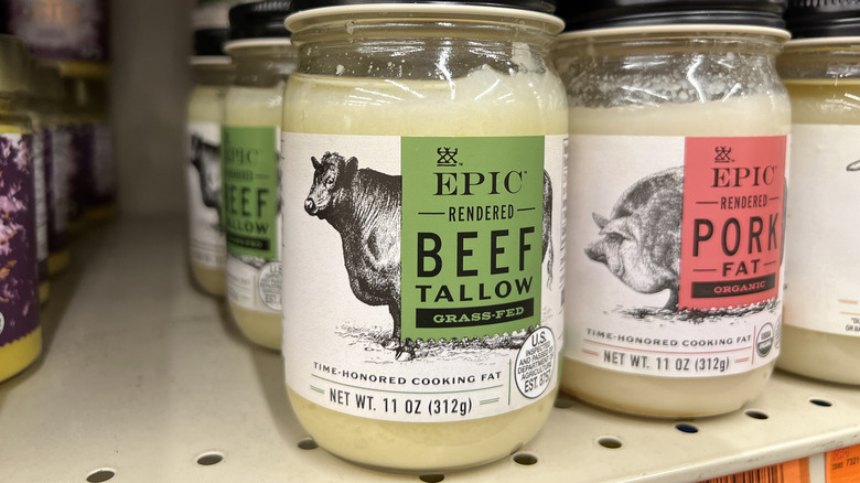 Jars of beef tallow on a grocery store shelf