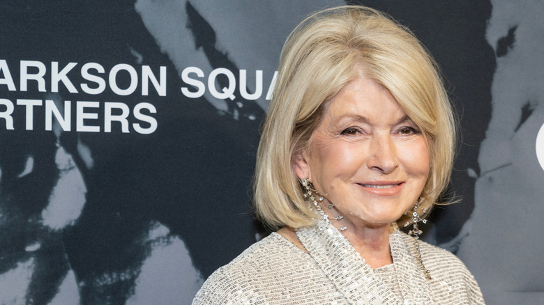 Martha Stewart smiling at the camera in a sparkly sequin top