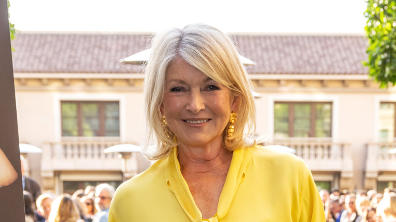 Martha Stewart smiling in a yellow shirt