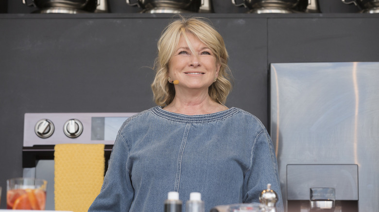 Martha Stewart smiling on-stage at an event