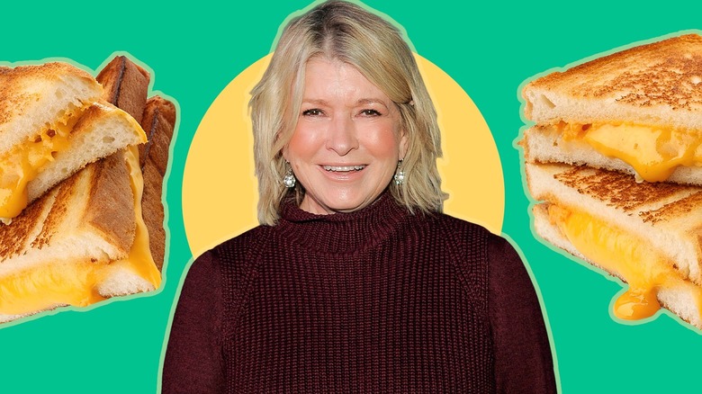 Martha Stewart smiling and two stacks of grilled cheese sandwiches on either side of her