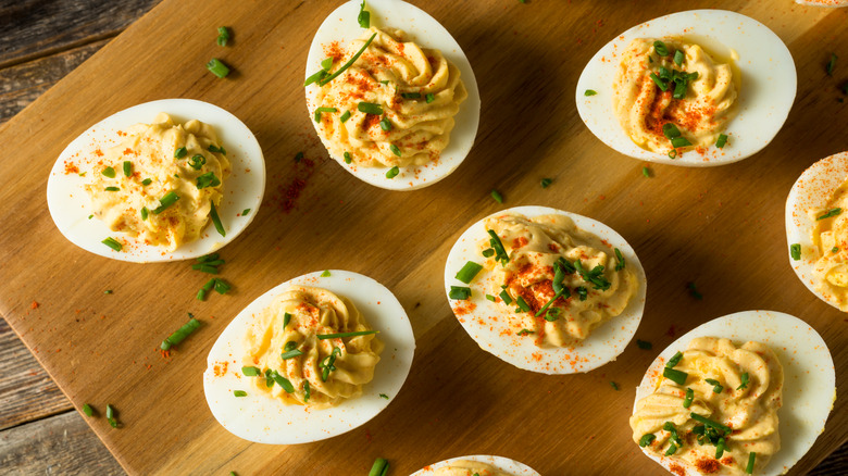 Deviled eggs on cutting board