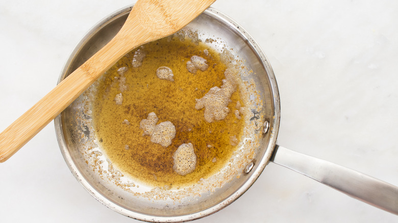 Browned butter in a stainless steel pain