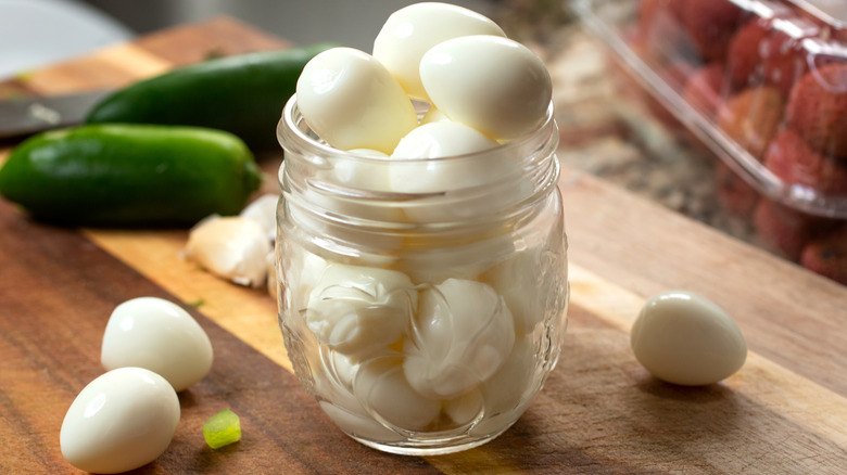 A Mason jar filled with boiled eggs.