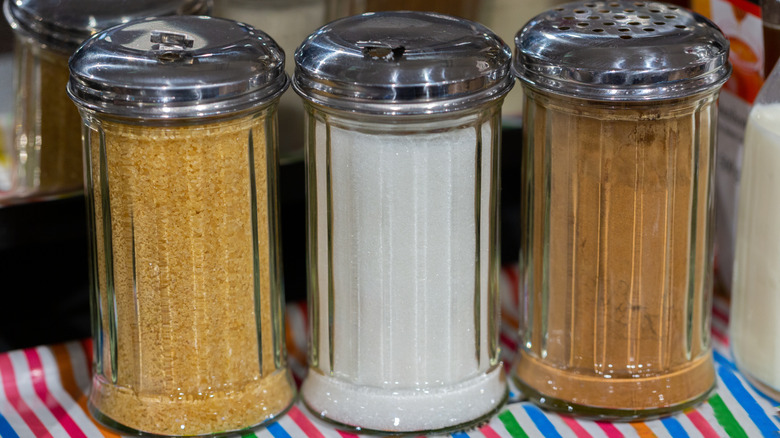 retro glass sugar dispensers on a table