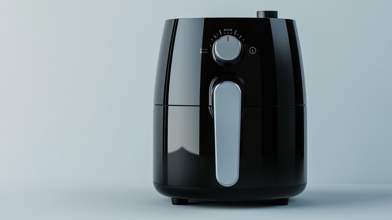 Air fryer on gray background