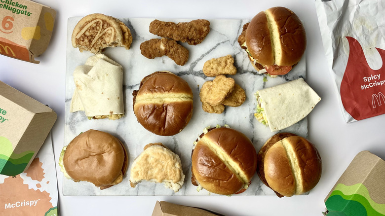 All of the chicken items from McDonald's on a marble surface with their packages