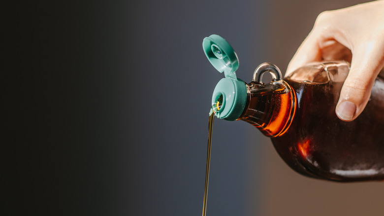 maple syrup pouring from a bottle