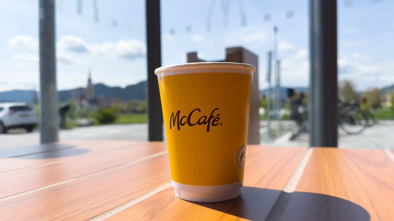 Cup of McCafé coffee on a table.