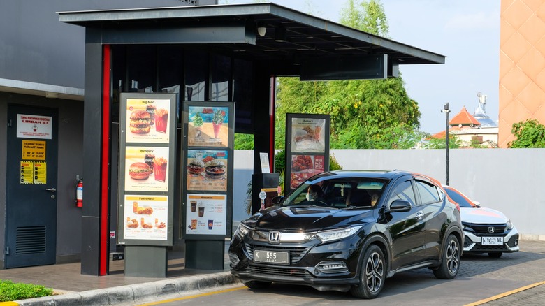 Two cars in a McDonald's drive-thru