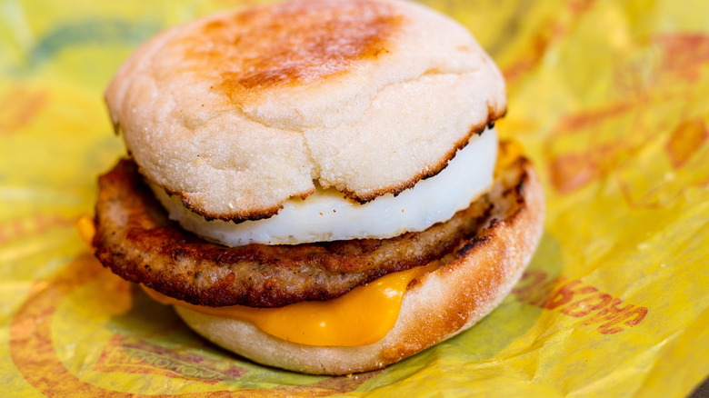 McDonalds Sausage McMuffin Breakfast Sandwich With Egg And Cheese Displaying Wrapper Featuring Golden Arches Logo