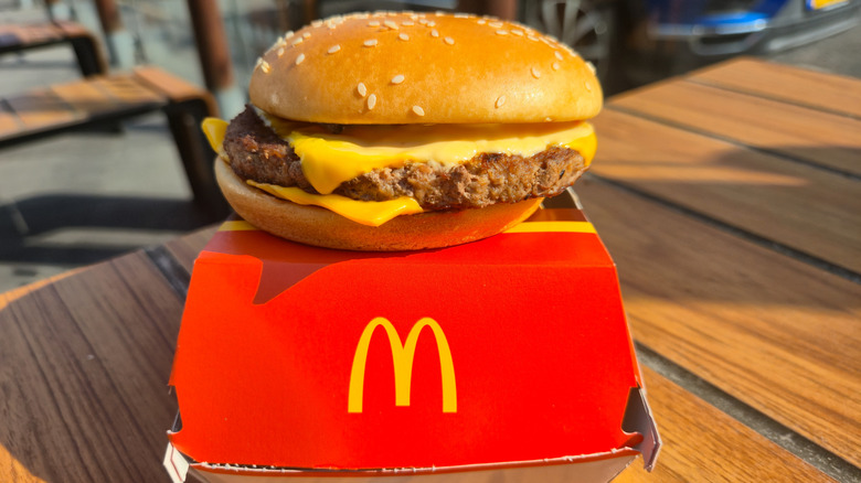 McDonald's Quarter Pounder Spicy burger sitting on top of its box