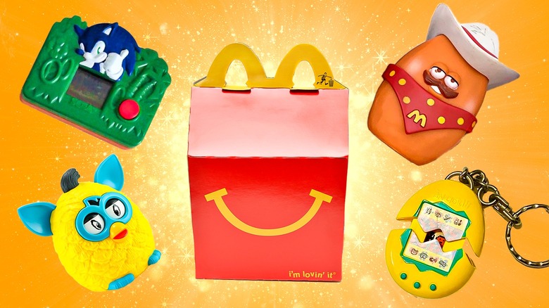 Happy Meal box surrounded by Happy Meal toys