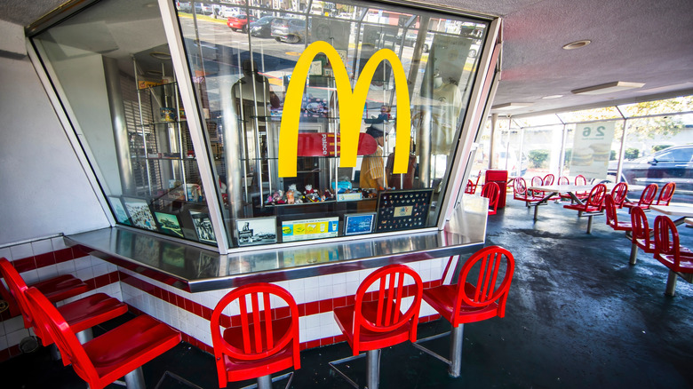 A counter at a vintage mcDonald's with memorabilia on display