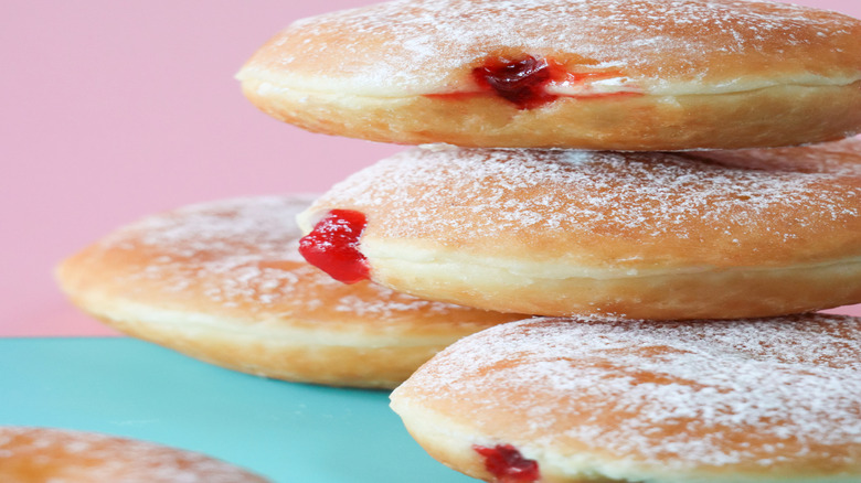 Jelly doughnut atop another jelly doughnut