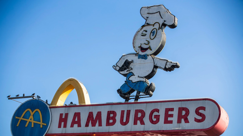 Speedee McDonald's signage with Speedee pointing