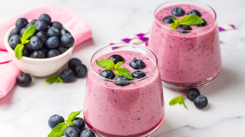 blueberry smoothies garnished with mint leaves
