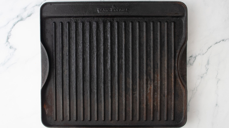 A large preheated grill pan