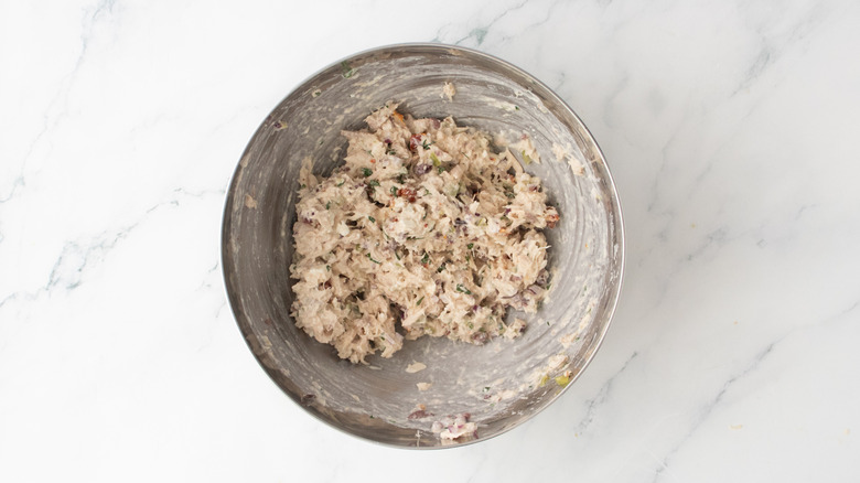A composed tuna salad in a metal bowl.