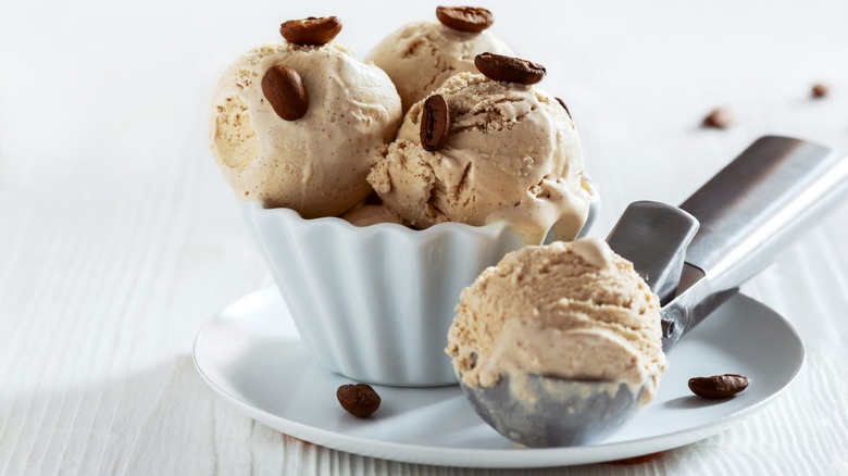 Small bowl of scoops of coffee ice cream with coffee beans