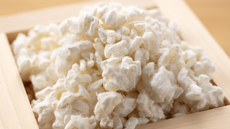 closeup of rice koji in a wooden box