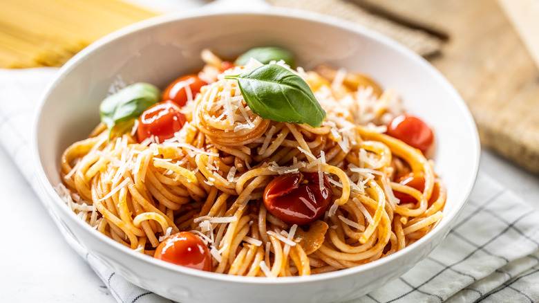 a plate of spaghetti with vegetables