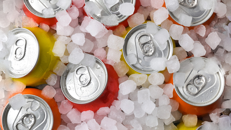 Colorful canned drinks in ice.