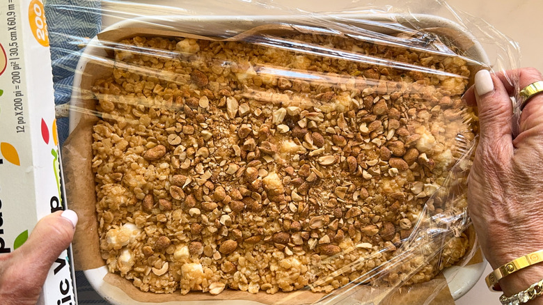 hand wrapping baking dish