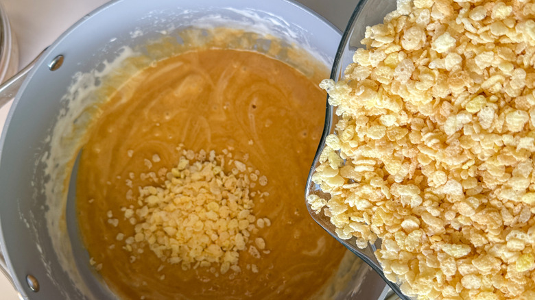 adding cereal to pot