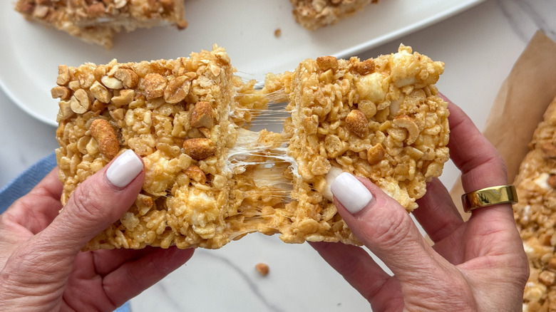 hands pulling apart a treat