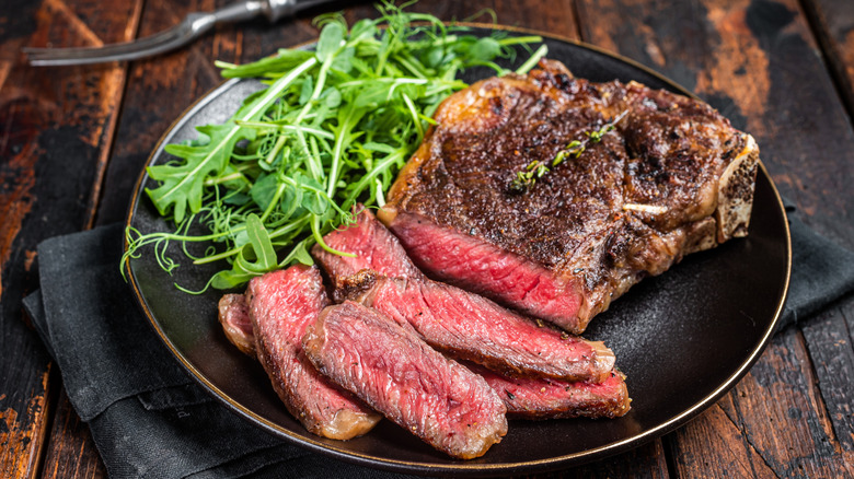 Sliced steak with arugula
