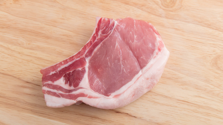 pork chop pictured on cutting board