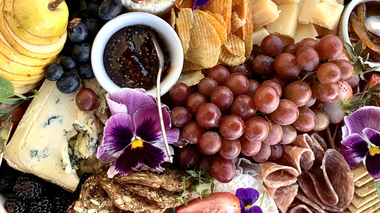 huge assortment of foods on charcuterie board