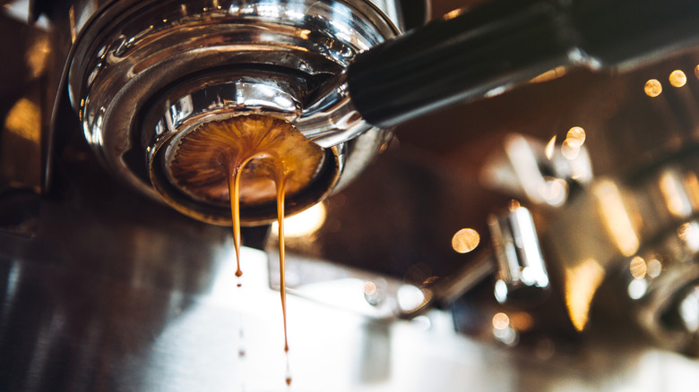 a close-up of an espresso drip from below