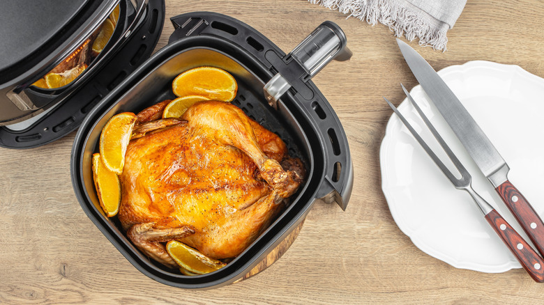 Whole chicken in air fryer basket