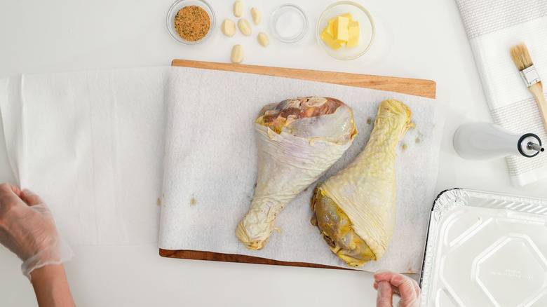 Chicken legs on kitchen towel