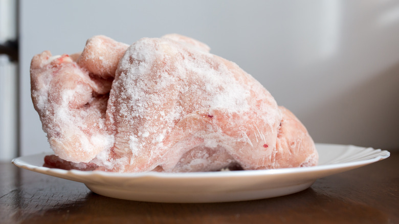 frozen whole chicken on plate