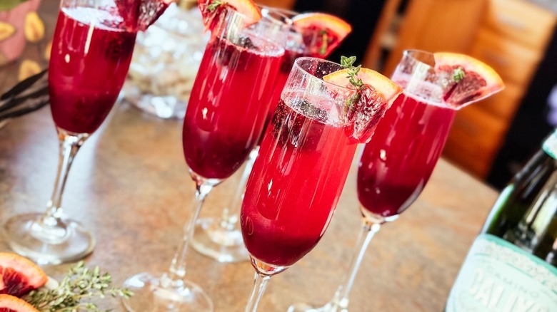 Mixed berry blood orange mimosas close up