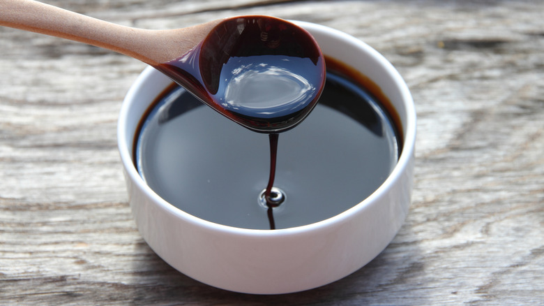 Molasses dripping in a bowl