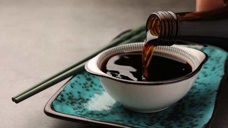 Dark soy sauce poured into a bowl