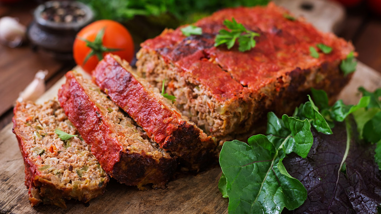 Baked meatloaf partially sliced