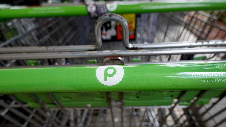 A close-up of a Publix shopping cart